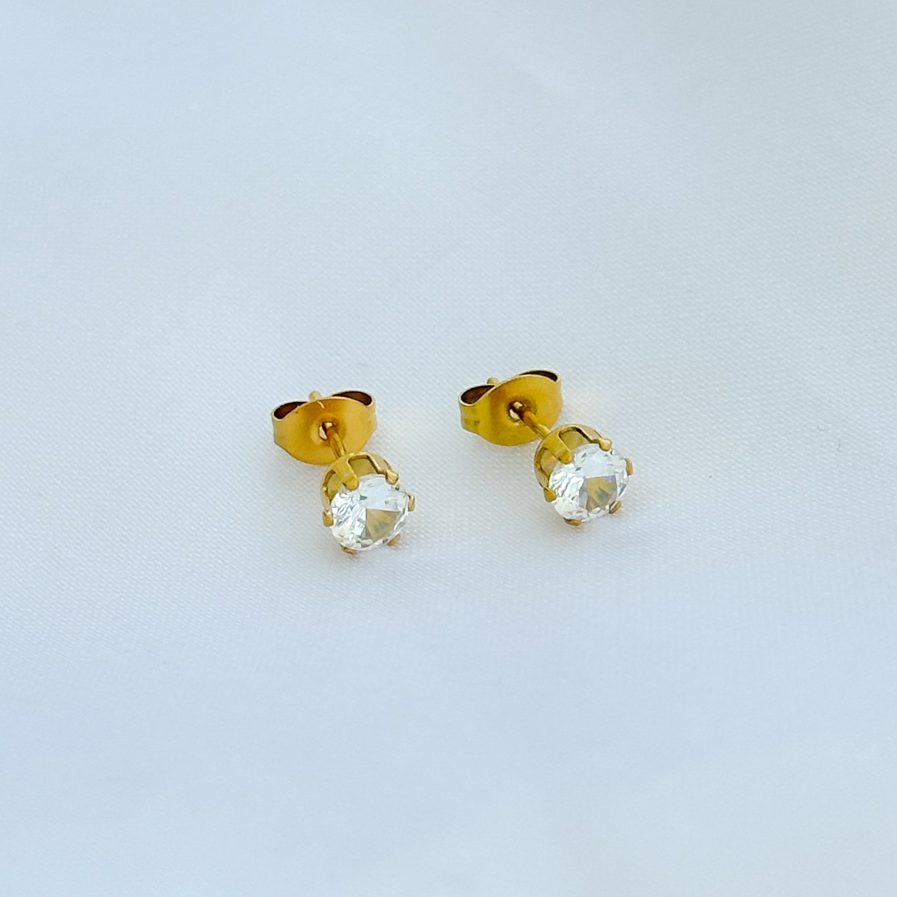 Brinco ponto de luz em aço