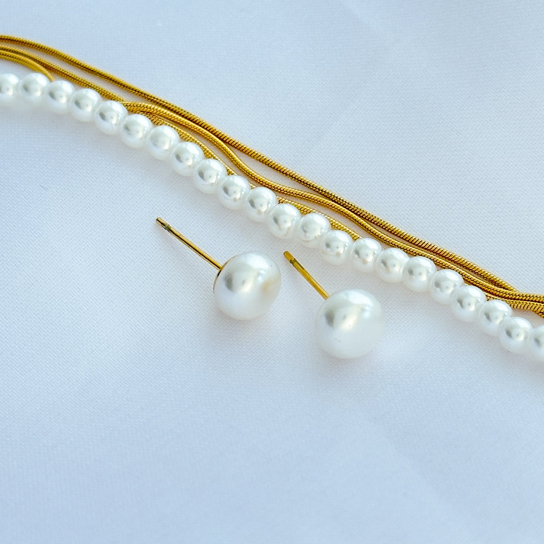 Conjunto mini pérola em aço