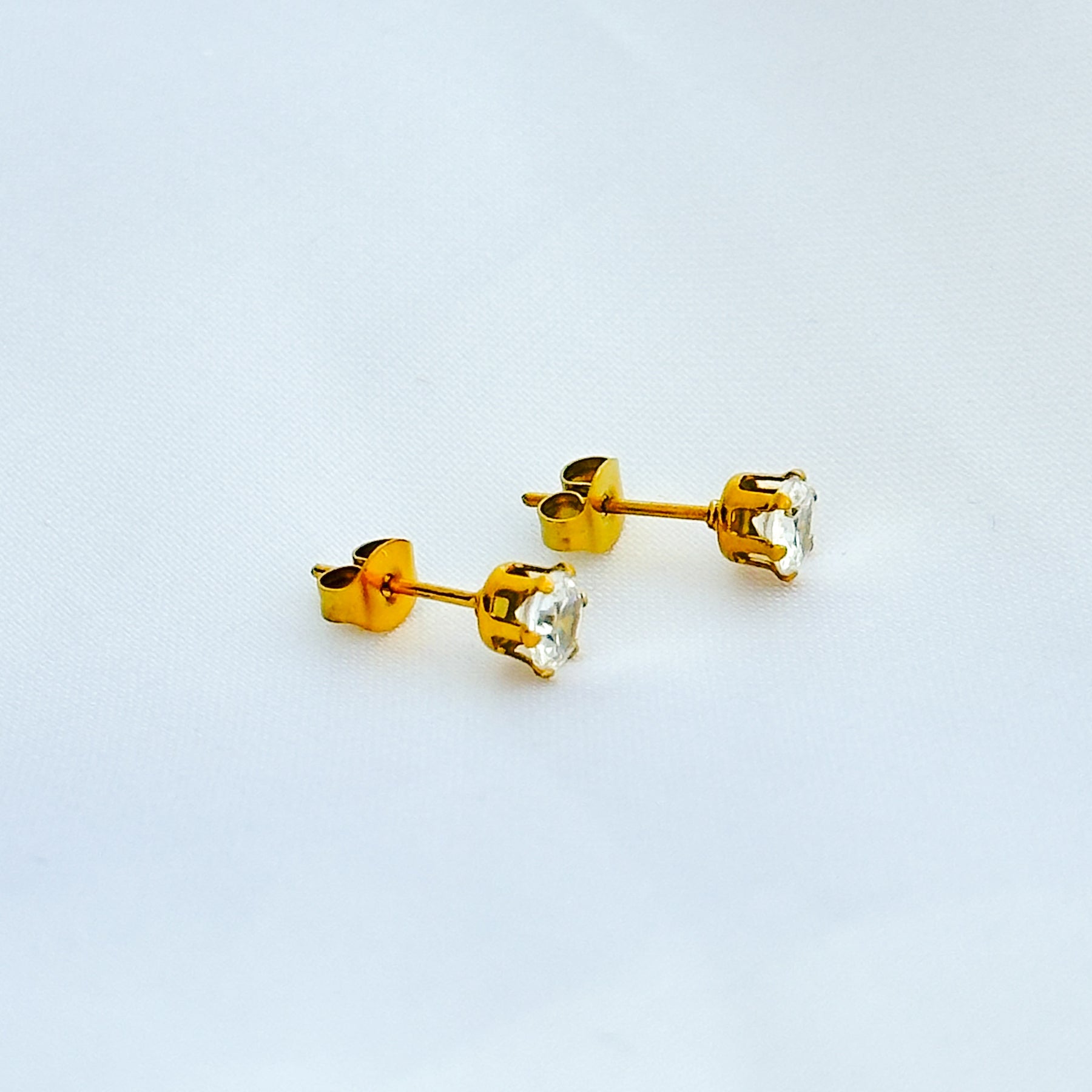 Brinco ponto de luz em aço